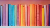 Colorful book spines arranged in rainbow order on shelf, featuring pastel and bright hues from purple to yellow, creating modern minimalist composition.