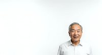 Senior Asian male with gray hair wearing light blue button-up shirt, smiling warmly against white background. Suitable for corporate, healthcare, business, and professional website use.