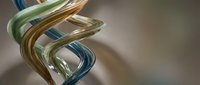 Abstract glass spiral sculpture with flowing curves in green, blue and amber colors on neutral background for modern interior design concepts.