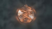 Transparent glass sphere ornament with warm glowing copper wire lights inside, hanging decoration for holidays and festive celebrations.