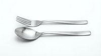 Stainless steel fork and spoon cutlery set isolated on white background for kitchen dining and restaurant use.