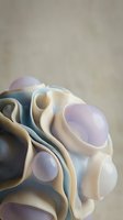 Layered ceramic vessels in cream, lavender, and slate tones arranged in organic composition. Smooth, curved forms with glossy finish showcase contemporary pottery craftsmanship. Suitable for home decor, art direction, and design inspiration.