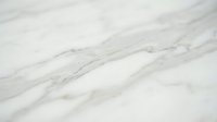 White marble stone surface with natural gray veining patterns for luxury interior design and architectural backgrounds.
