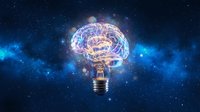 Glowing brain inside lightbulb against starry space background representing innovation, creativity, intelligence and bright ideas for business concepts.