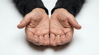 Open cupped hands gesture showing palms in protective caring position isolated on white background for charity donation and support concepts.