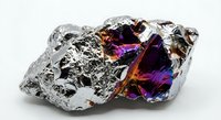 Iridescent bismuth crystal specimen displaying rainbow metallic colors and geometric stepped formations on white background isolated for design.