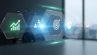 Digital business analytics interface with glowing hexagonal icons showing growth charts, target goals and data visualization in modern office.