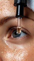 Close-up of eye drops application showing transparent liquid falling from dropper onto blue eye with long eyelashes and moisturized skin texture.