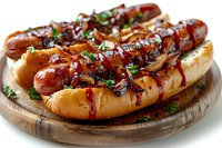 Grilled hot dogs topped with caramelized onions, fresh herbs and barbecue sauce served on toasted buns, perfect for menu, restaurant promotion or cookbook design.