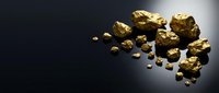 Gold nuggets scattered on dark surface with dramatic lighting for luxury investment and precious metal concepts.