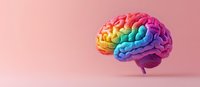 Rainbow colored anatomical brain model on pink background showing creative thinking and neurodiversity concept for mental health awareness.
