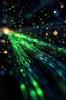 Glowing green fiber optic strands emit radiant light against dark background with floating bokeh particles creating magical atmosphere for technology designs.