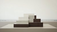 Minimalist geometric wooden blocks arranged in stepped formation on neutral surface creating modern abstract composition for contemporary design projects.