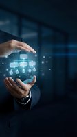 Businessman hands protecting glowing organizational chart hologram in modern office environment representing corporate hierarchy and management structure.