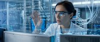 Female scientist in lab coat and safety glasses analyzing data on transparent digital interface screen in modern laboratory environment.