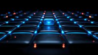 Futuristic keyboard with glowing blue backlight and red accents creates dramatic perspective view against dark background, modern gaming or technology concept.