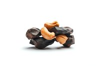 Dark chocolate chunks with roasted cashew nuts on white background, isolated food composition for confectionery and dessert designs.