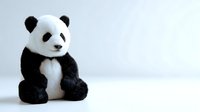 Adorable panda bear plush toy sitting on white background, soft cuddly stuffed animal for children, nursery decor and gift concept.