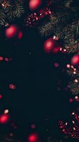 Red glittering Christmas baubles and pine branches against dark background with bokeh lights creating festive holiday atmosphere for seasonal designs.