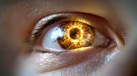 Extreme close-up of human eye with fiery golden iris and supernatural glowing ring effect, symbolizing power, vision, and mystical energy.