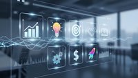 Digital business interface with glowing icons showing growth charts, lightbulb, target, gears, dollar sign and rocket in modern office environment.