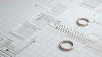 Technical blueprint drawings with wedding rings on grid paper for engineering and marriage planning concepts.