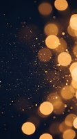 Golden bokeh lights sparkle against deep blue background creating magical atmosphere for holiday celebrations and festive events.