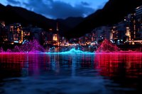 Vibrant sound wave visualization reflected on water surface against night city skyline, glowing neon pink and blue audio spectrum mirroring urban lights.