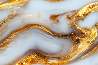 Luxurious white marble texture with flowing gold veins and glitter effect creates elegant abstract pattern for luxury design and decoration backgrounds.