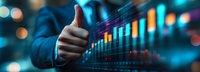 Business person showing thumbs up approval gesture with financial data charts and stock market analytics in digital background.