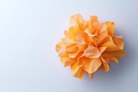 Orange paper flower with delicate layered petals on white background, isolated decorative origami art piece suitable for craft and design projects.