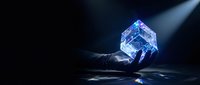 Glowing blue crystal cube held in hand against dark background, representing innovation, technology, data processing, and digital transformation for business concepts.