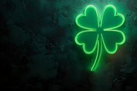 Glowing neon green four leaf clover sign against dark textured wall. Lucky charm symbol illuminated with bright fluorescent light creates modern pub atmosphere.