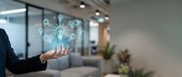 Young professional woman in business attire displaying holographic network icons and digital connectivity symbols in modern office environment for technology and communication concepts.