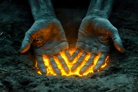 Mystical glowing hands cupping magical fire light against dark background, creating supernatural effect with orange illumination emerging between fingers.