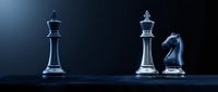 Glass chess pieces king queen and knight on dark background with dramatic lighting for strategic business concepts and competitive gameplay.