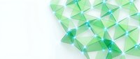 Abstract green geometric pattern with translucent triangular shapes creating modern digital background for presentations and web design projects.