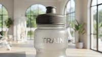 Frosted sports water bottle with black cap and embossed text, displayed in bright modern interior with arched windows and plants, suitable for product marketing and lifestyle design.