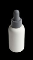White dropper bottle with gray cap isolated on transparent background, ready for cosmetic, skincare, and pharmaceutical packaging design mockups, labels, and print-on-demand products.