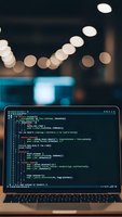 Laptop displaying colorful code on screen in modern office environment with bokeh lights creating atmospheric programming workspace for developers.