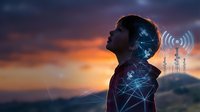 Young businessman silhouette with digital network overlay against sunset sky, representing wireless communication technology and connectivity solutions.