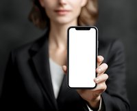 Businesswoman in formal attire showing blank smartphone screen, perfect for app mockup or digital presentation in corporate setting.