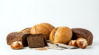 Assorted fresh baked bread loaves and rolls isolated on white background, ready for bakery, food, and culinary design projects.