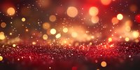 Red and gold glowing bokeh lights on dark background with sparkle effect and glitter texture, creating magical festive atmosphere for holiday designs.