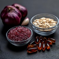 Fresh red onions, brown rice, oat flakes and omega-3 supplements arranged on dark background. Healthy ingredients for balanced nutrition and heart health.