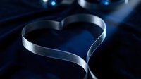 Silver satin ribbon shaped into a heart on dark blue velvet fabric, romantic Valentine's Day concept with elegant luxury feel.