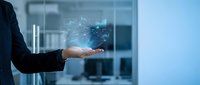 Businessperson holding glowing digital data visualization and network connections in palm, representing technology innovation, cloud computing, and business intelligence solutions.