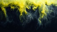 Yellow and black abstract fluid art with swirling smoke effect and dark background creates dramatic contrast for creative design projects and wall decor.
