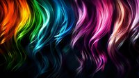 Vibrant rainbow colored wavy hair strands flowing against dark background create dynamic motion effect, suitable for beauty salon and hair styling promotional materials.