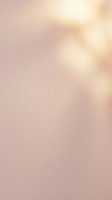 Soft blurred gradient background transitioning from warm beige to dusty rose tones, creating an elegant bokeh effect suitable for overlays and design projects.